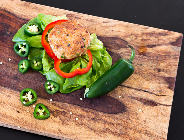 Jalapeno Chicken Burger on wooden cutting board