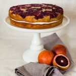 blood orange spice cake on white cake stand