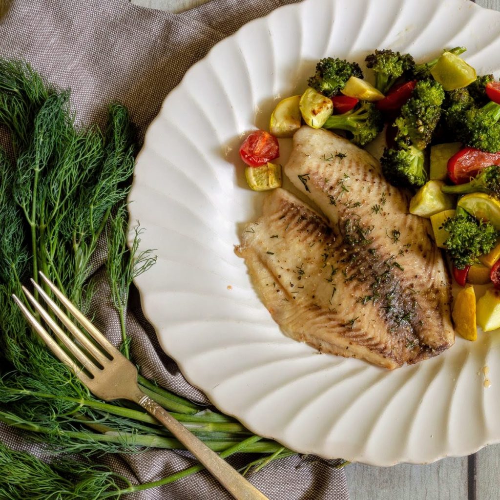 Tilapia and Roasted Vegetables seasoned with dill.