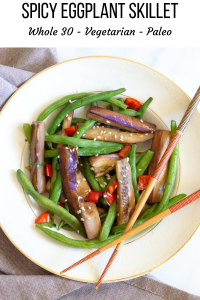 Eggplant, green beans, red pepper, in a white bowl with chop sticks